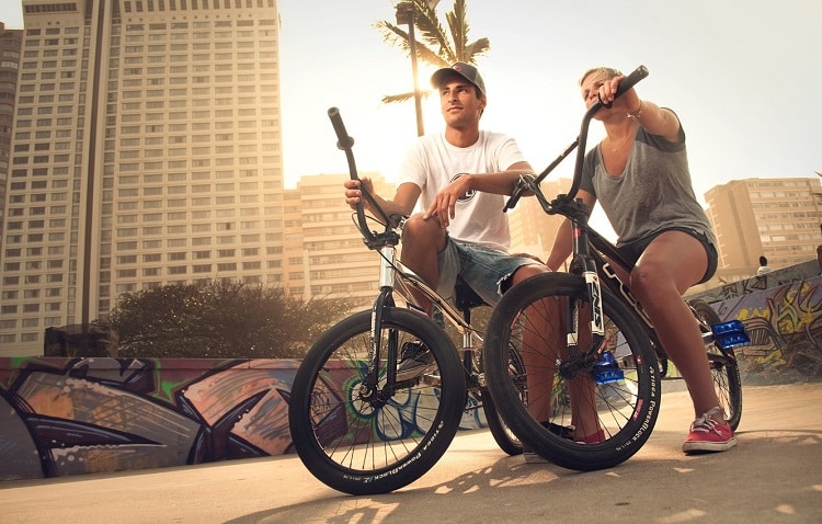 Man And Female Sitting On BMX
